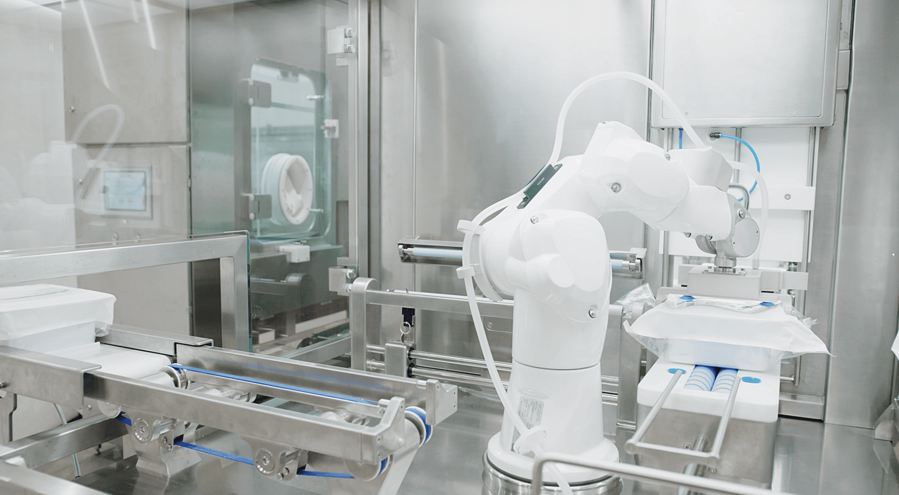 AST aseptic fill-finish machinery in action in a cleanroom setting for pharmaceutical manufacturing